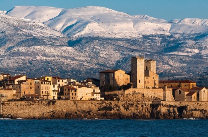 The ramparts of Antibes with the snowy Alps the background