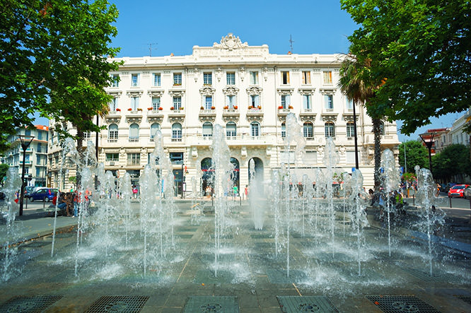 Fountain square and facade of Grand Hotel Antibes French Riviera