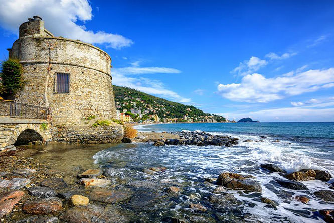 Historical Saracen tower on mediterranean beach in Alassio