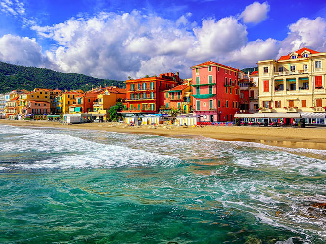 Mediterranean sand beach in traditional touristic town of Alassio