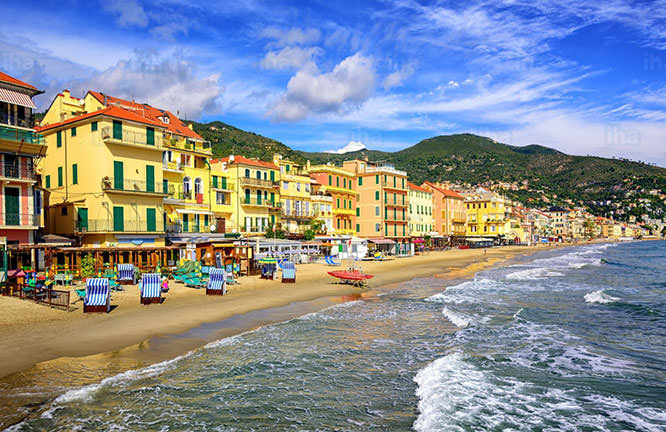 Mediterranean sand beach in traditional touristic town of Alassio