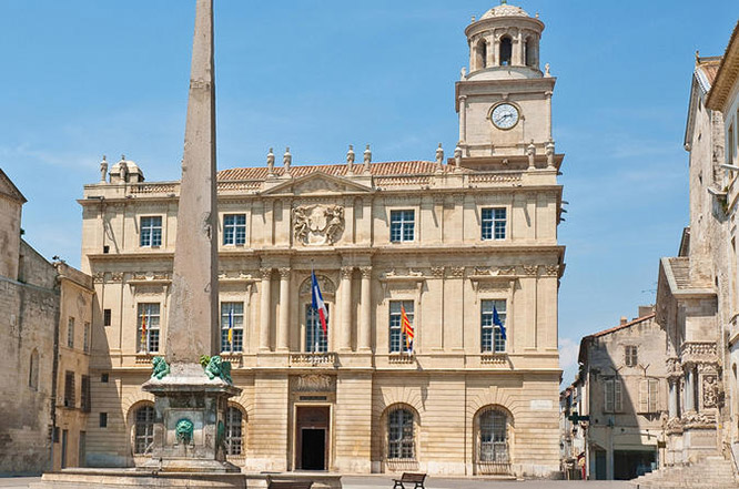 Obelisk and Church of St. Trophime on Place de la Republique in Arles