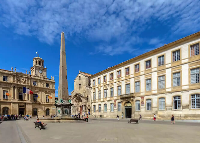 Obelisk and Church of St. Trophime on Place de la Republique in Arles