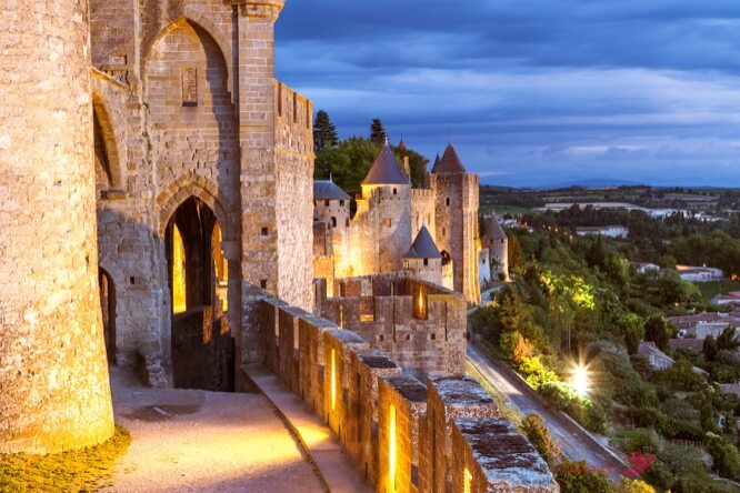 Walls and towers of the old town at dusk