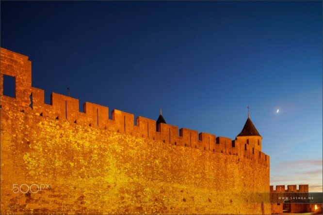 Carcassonne medieval fortress highlighted at night