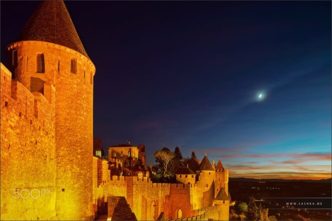 Carcassonne medieval fortress highlighted at night