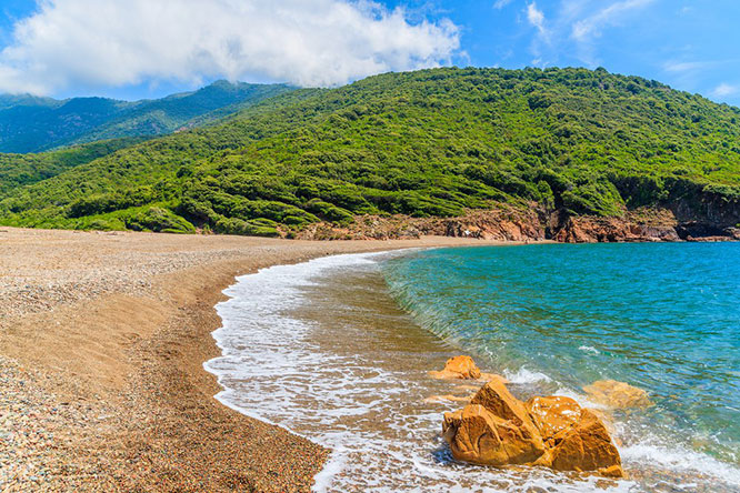 Beautiful secluded beach with azure sea water near Girolata bay