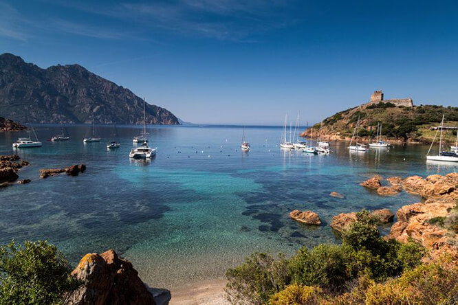 Elevated view of yachts anchored in the bay of Girolata