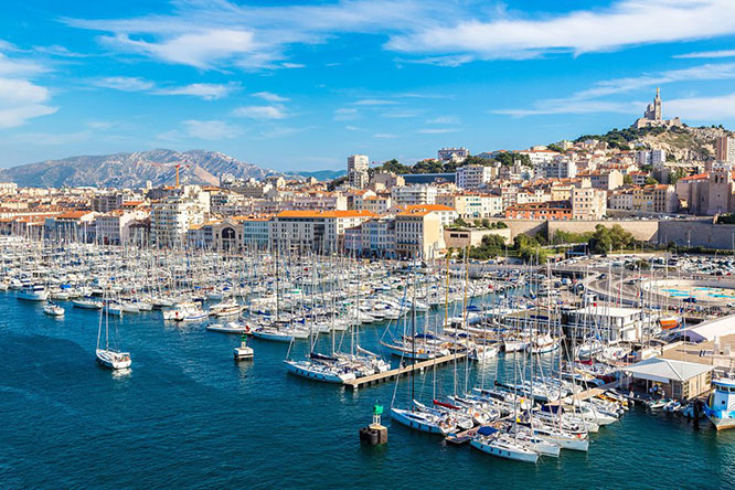 Aerial panoramic view on basilica of Notre Dame de la Garde and old port in Marseille