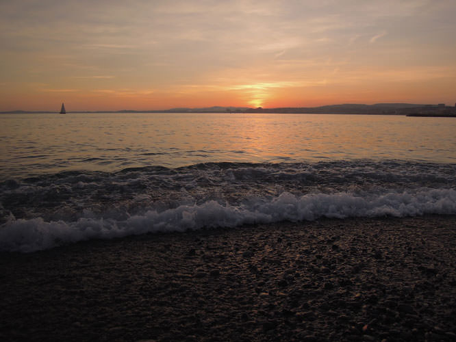 View of Villeneuve and Antibes from Cagnes sur Mer's beach French Riviera