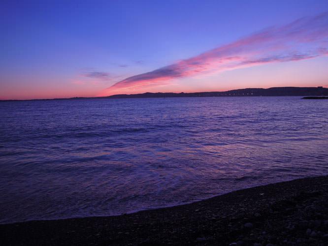 View of Antibes and Cap d'Antibes from Cagnes sur Mer's beach French Riviera