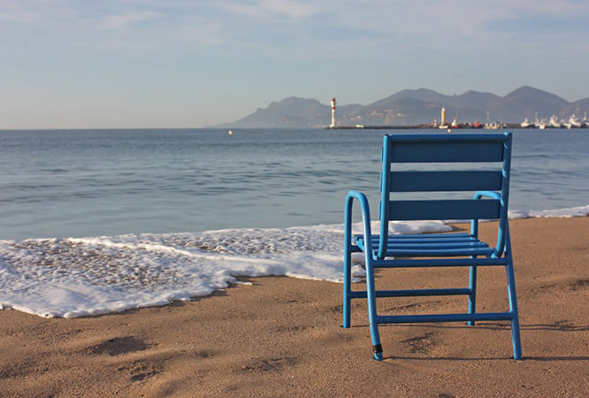 Blue chair on the beach of Cannes