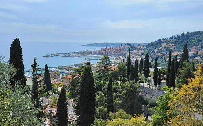 View on the port and the old town of Menton from a private garden