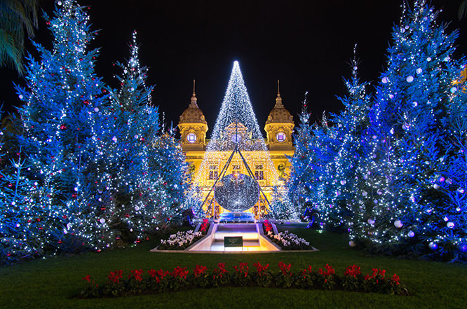 Christmas tree in front of the palace of casino of Monaco at dusk