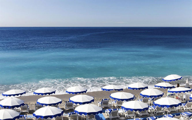 Beach parasols in Nice French Riviera