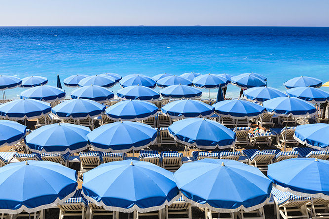 Beach parasols in Nice French Riviera